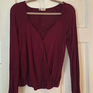 Sexy, red, long sleeve blouse with low neck with cross cross, size small
